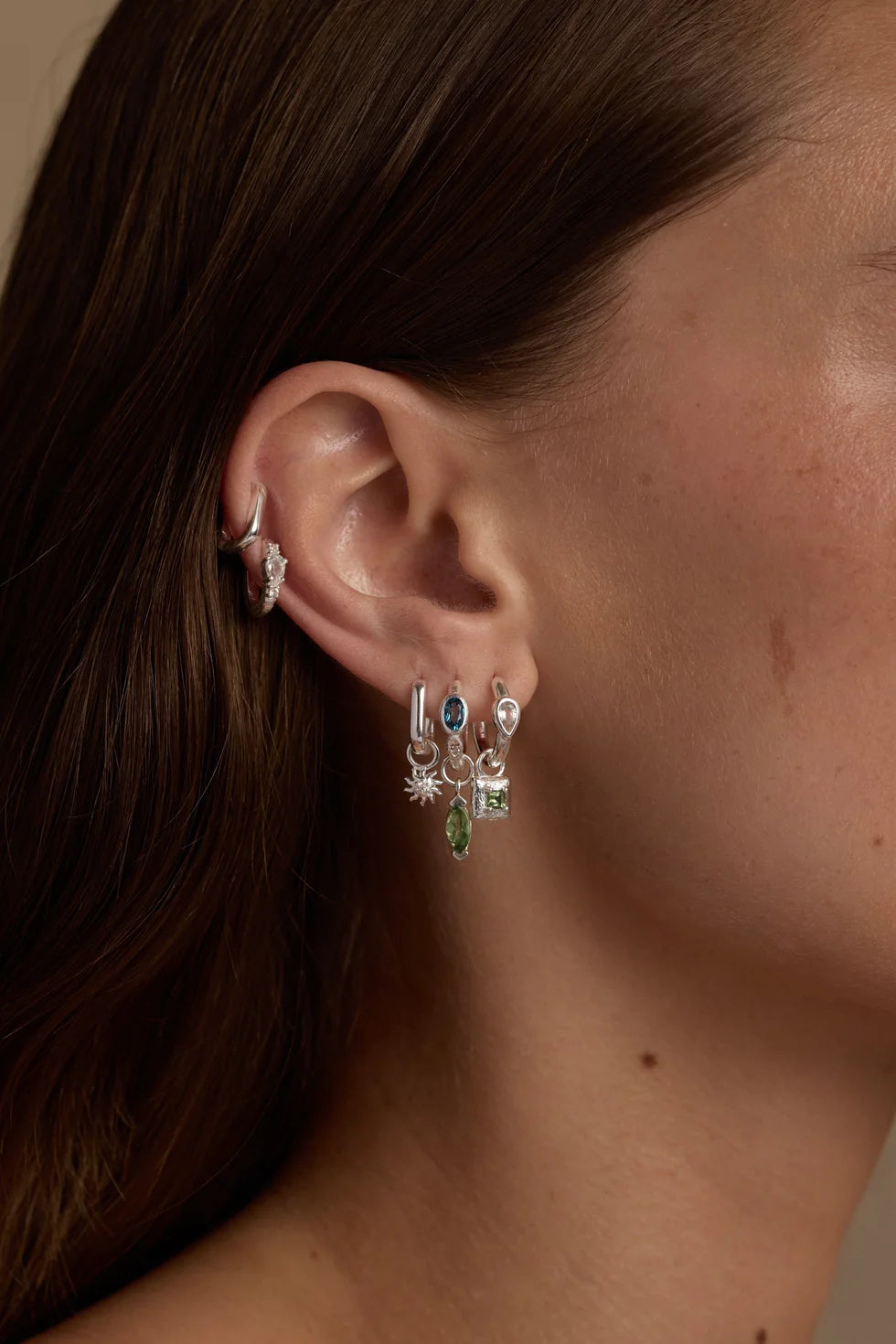 Toni May - Topaz Silver Huggies