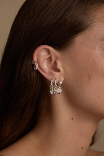 Toni May - Topaz Silver Huggies